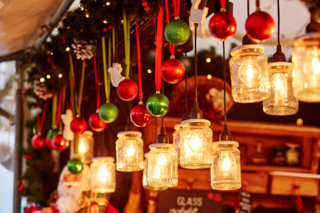 DEcorations hanging from a Christmas market stall