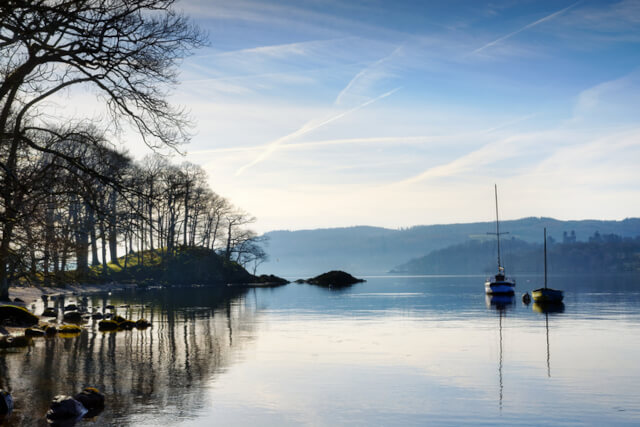 A view across the water of Lake Windermere in the morning