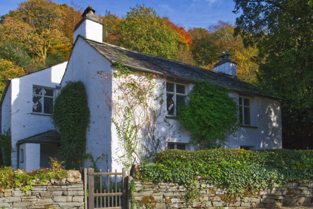 An external shot of the whitewashed building of Dove Cottage in Grasmere
