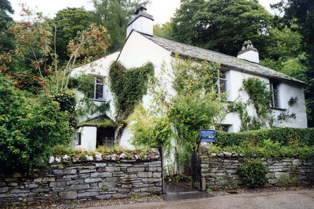 An external view of Dove Cottage showing the greenery growing up the walls