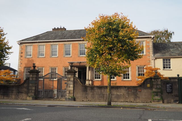 External shot of the double fronted orange building of Wordsworth House