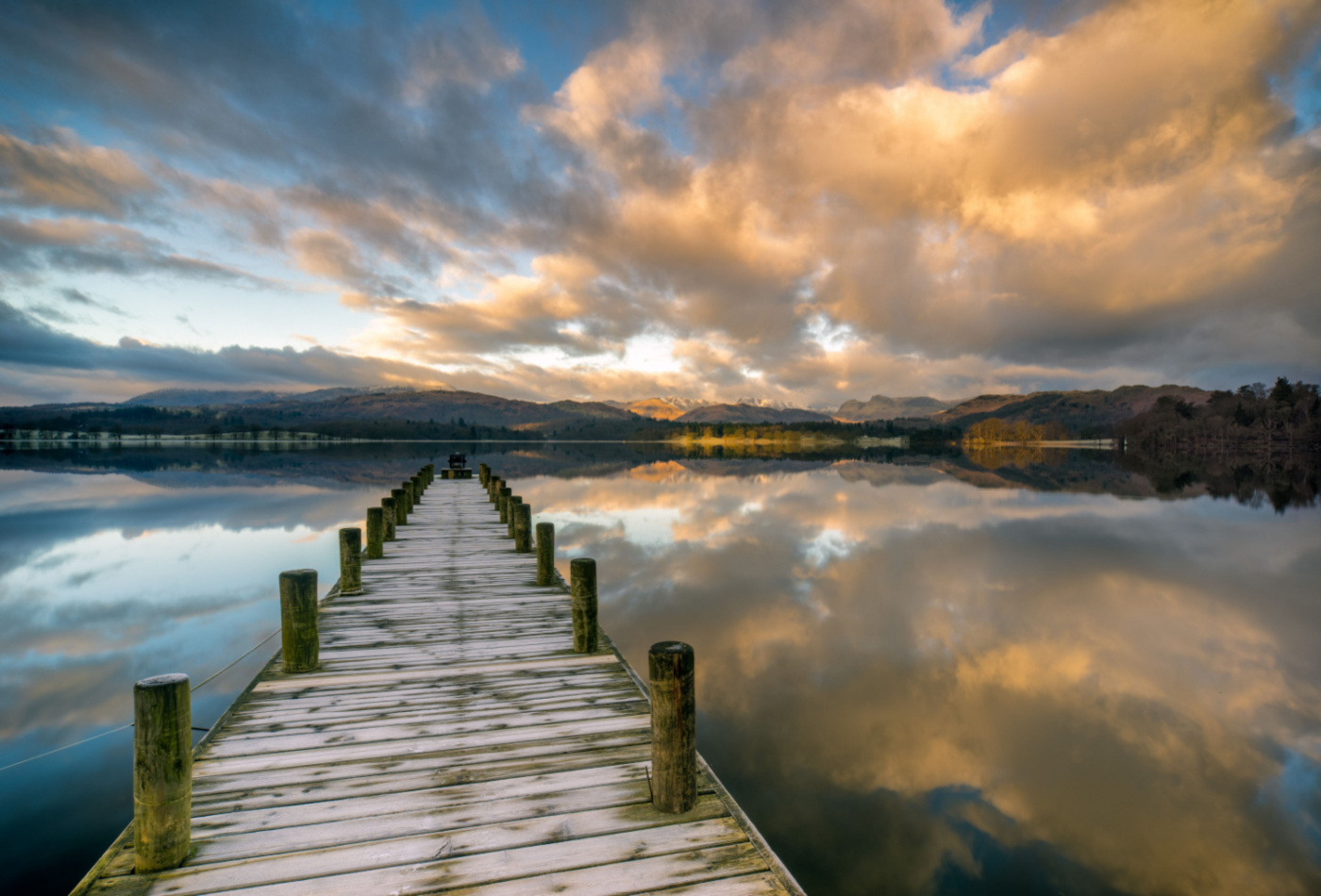 Wooden jetty leading out to lake Windermere. Winderemere, Lake District Owners