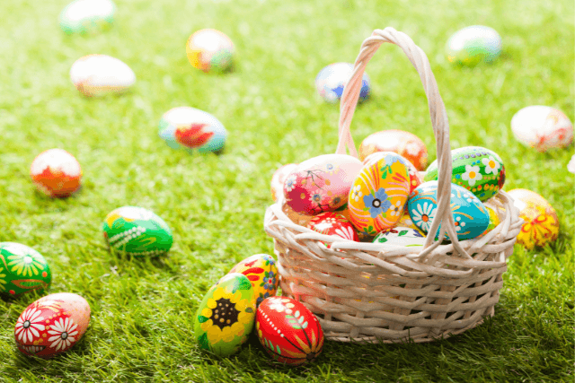 A basket full of colourfull easter eggs.