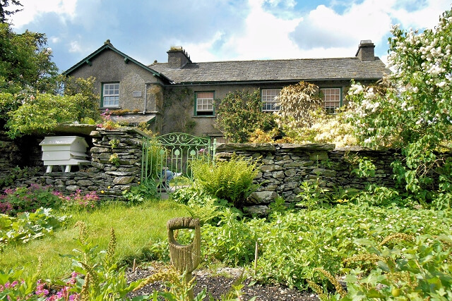 An external shot of Hill Top House and its green garden